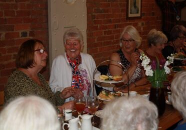 People Enjoying Afternoon Tea