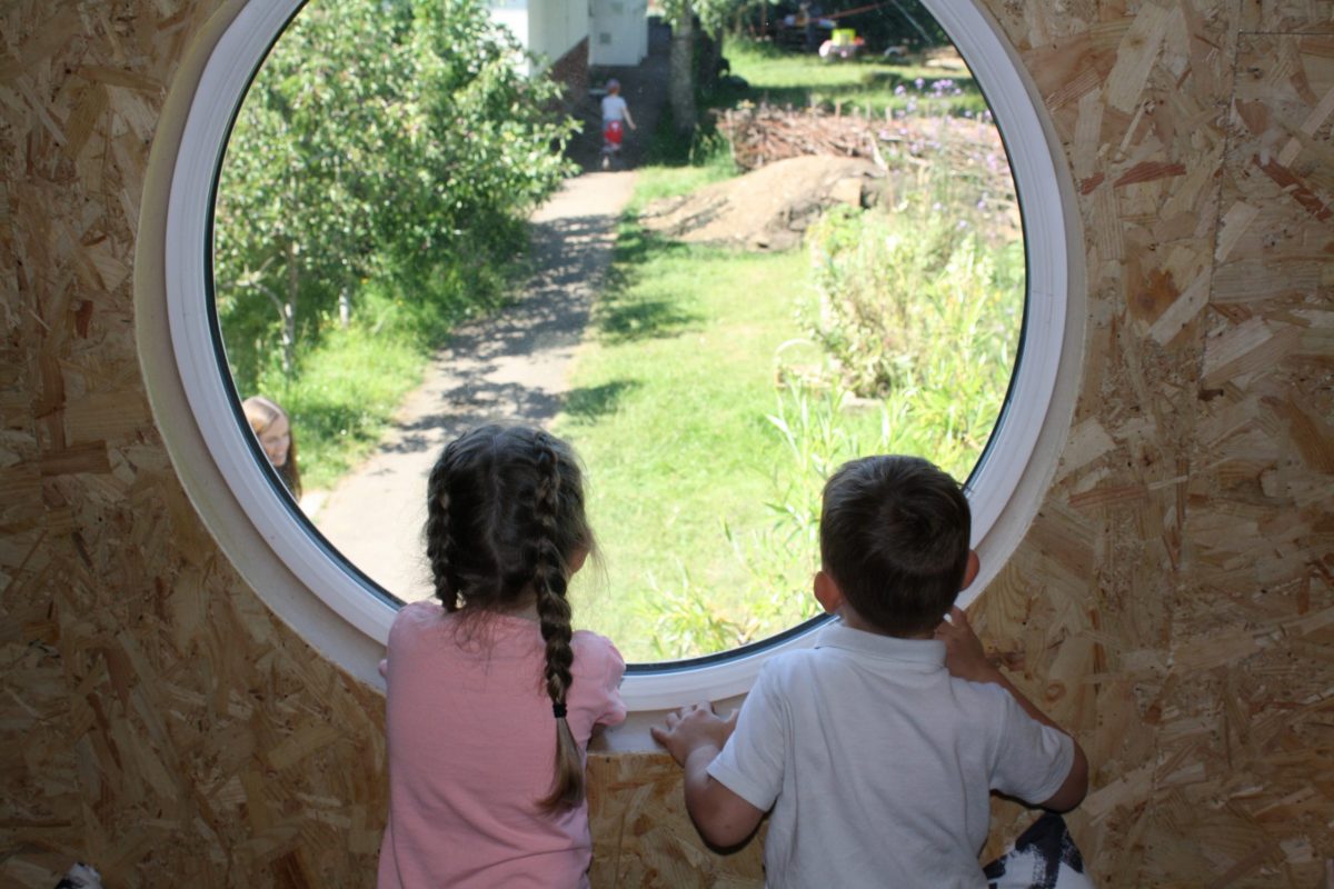 Children Looking Cabin Window