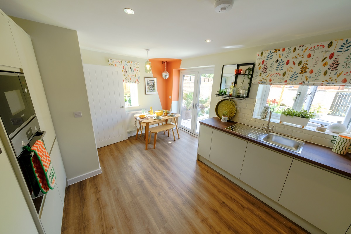 One at Charterholme show home kitchen to dining area