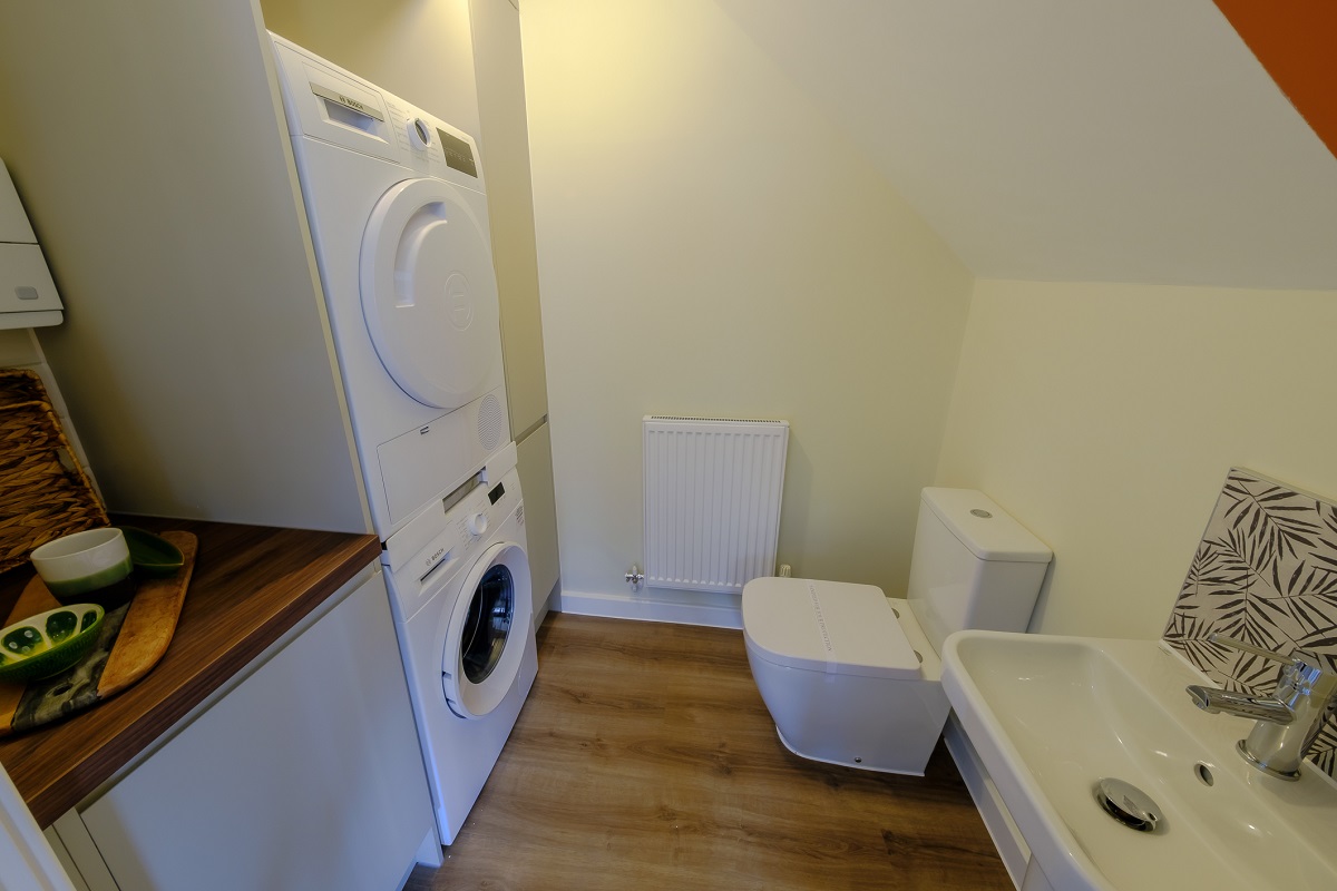 One at Charterholme show home utility cloakroom