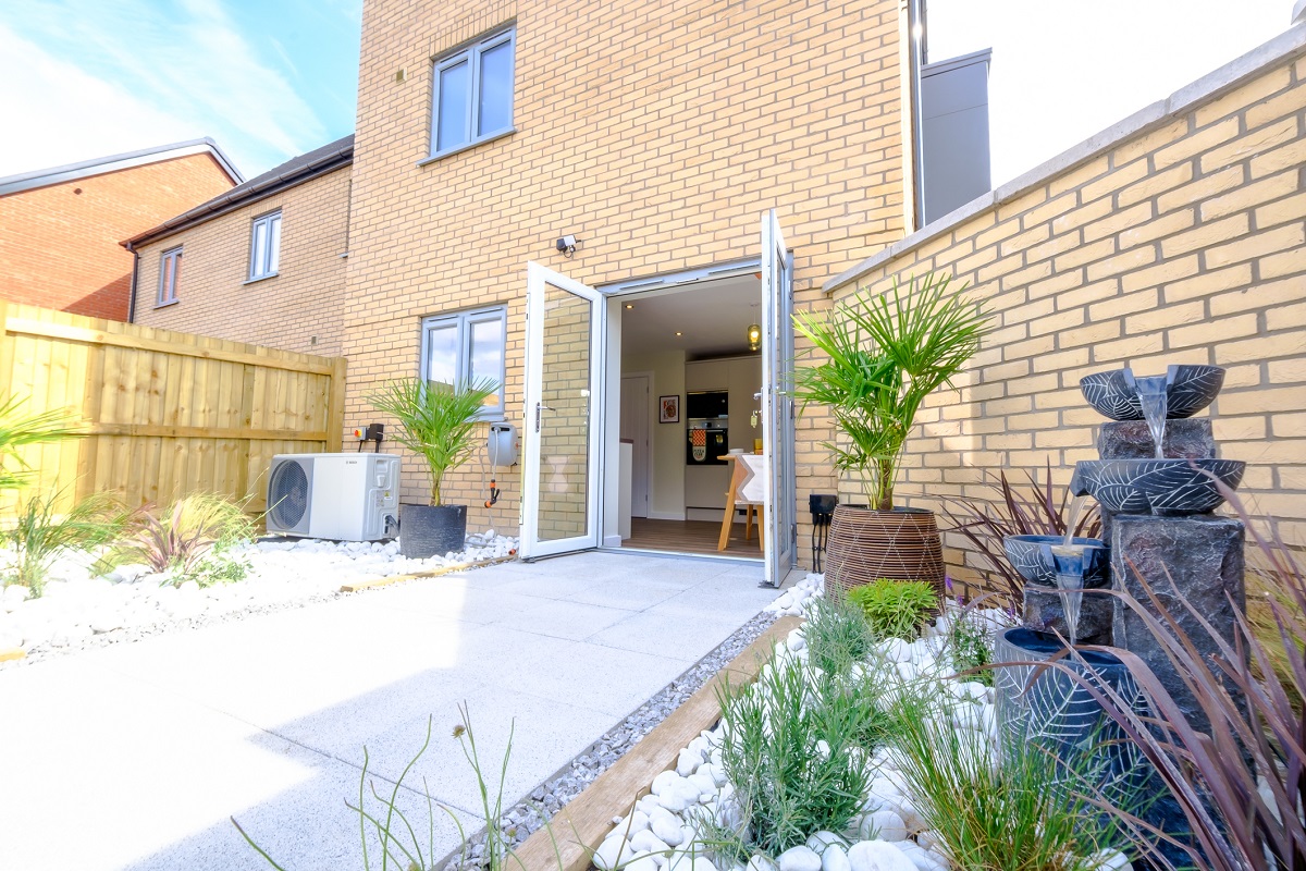 One at Charterholme show home garden to kitchen